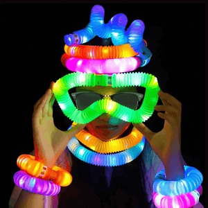 Woman wearing luminous pop tubes on black background