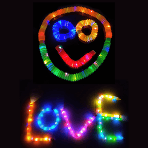 Words and smiley face made of luminous pop tubes on black background