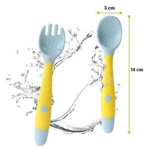 Yellow flexible spoon for baby with dimensions water splash on white background