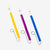 Yellow, purple and blue slide whistles on a white background