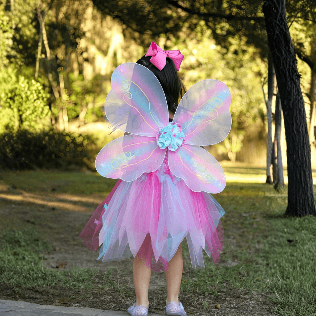 Back view of girl wearing pink butterfly wings and dress costume