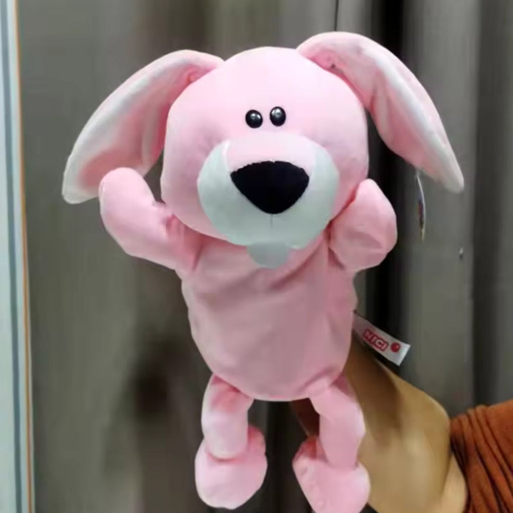 Pink rabbit hand puppet held up showing front view with floppy ears and expressive face