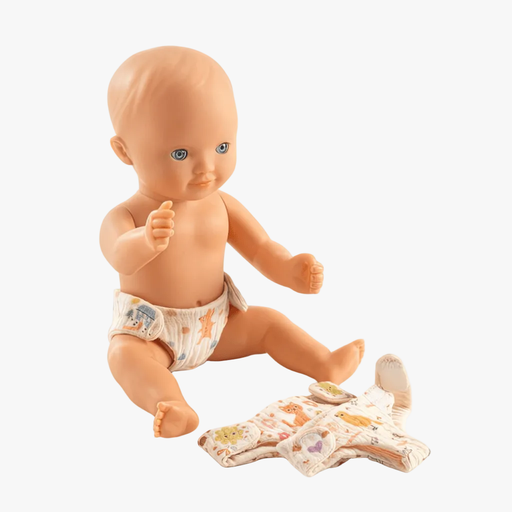Baby doll wearing reusable cotton nappy with soft fabric and velcro fastening