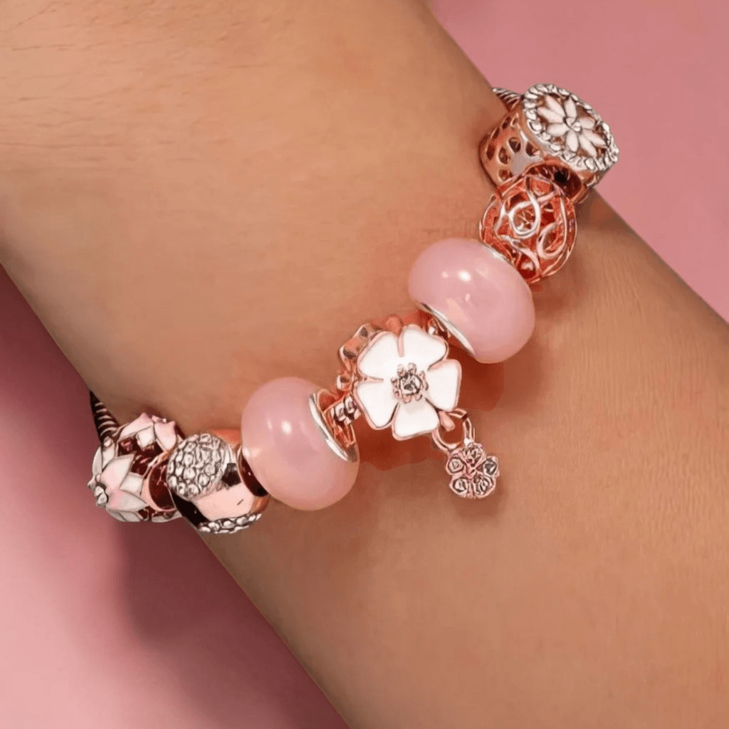 rose gold fidget charm bracelet worn on wrist — pink resin beads floral enamel CZ — Sensory Stand
