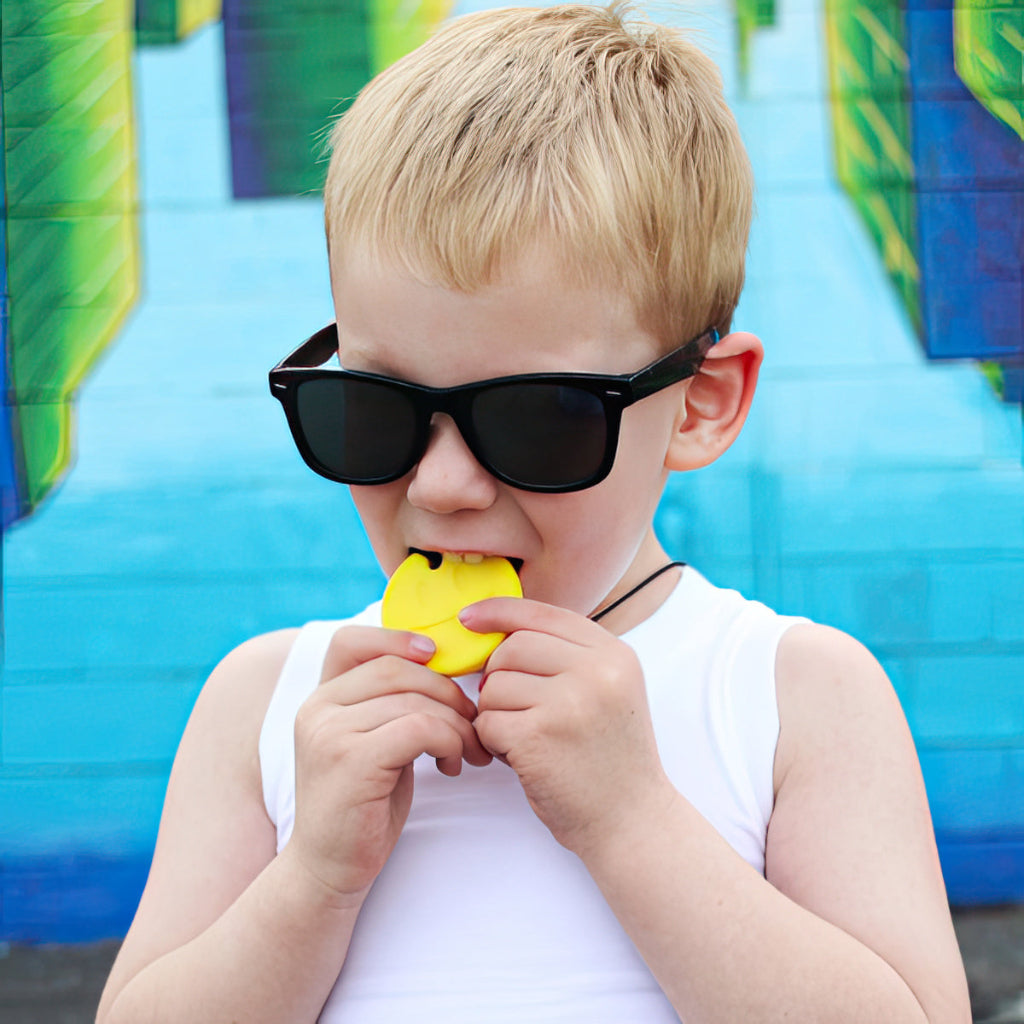 smiley chewelry chew necklace with child 1