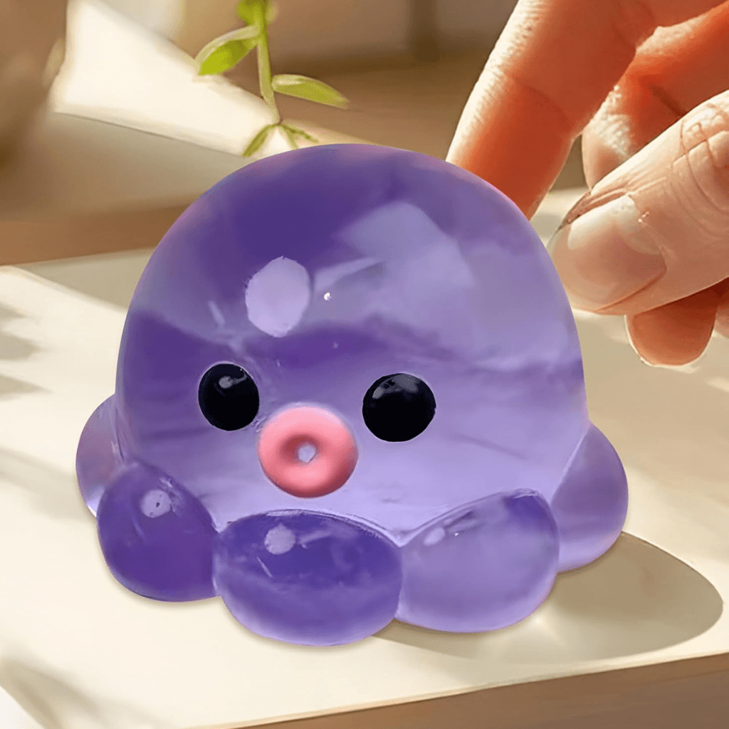 Hand pressing octopus calm squishy showing soft texture and calming sensory feedback
