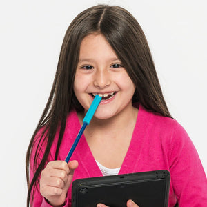 Girl holding a tablet while chewing on a teal Ark's krypto bite chewie pencil