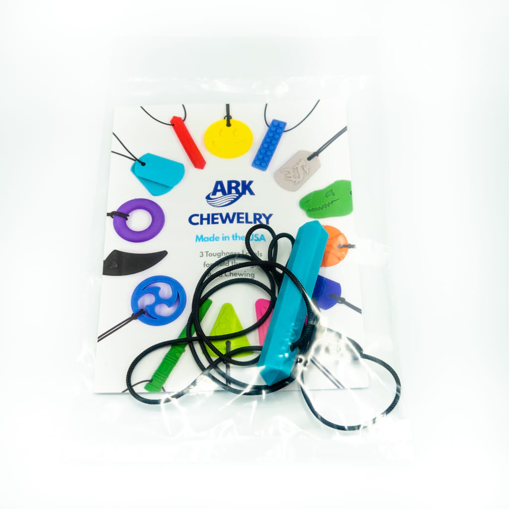 Ark's krypto bite chewy necklace in teal xt medium toughness in its package GEM100XTTealAW