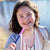 Adolescent girl holding Ark's sensory pen topper