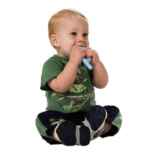 Baby boy chewing on Ark's baby grabber silicone teether Australia