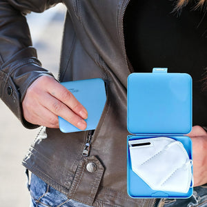 Woman's hand holding a blue face mask storage case 