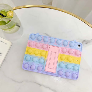 Fidget popper iPad case in pastel colours on a marble table