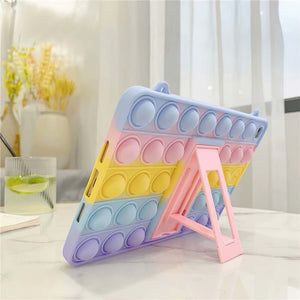 Pop it fidget toy iPad case in pastel colours on a marble table