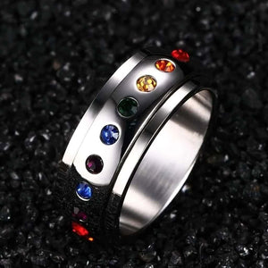 Stainless steel multi colored stones silver women fidget ring on back background