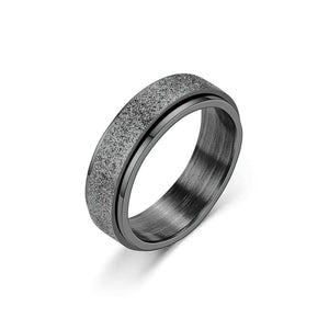 Black stainless steel sparkly spinner ring on white background