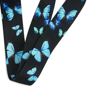 Teacher lanyard blue butterflies on black background close up