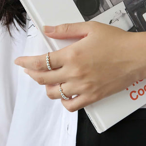 Woman wearing 2 sterling silver bead anxiety rings australia